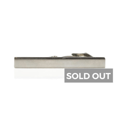 a silver tie bar with reflection and a sold out sign